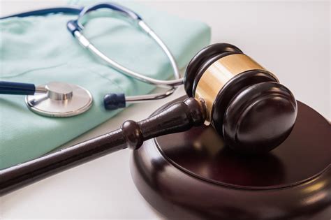 Doctor's scrubs and judge's gavel